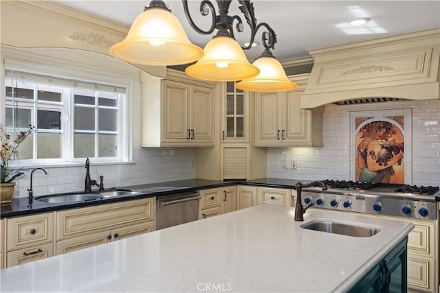 22052 Susan Ln, Huntington Beach, CA 92646 - kitchen with cream cabinets, stainless steel appliances, a sink, backsplash, and ornamental molding