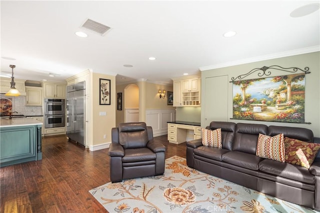 22052 Susan Ln, Huntington Beach, CA 92646 - living room with recessed lighting, arched walkways, ornamental molding, and dark wood-type flooring