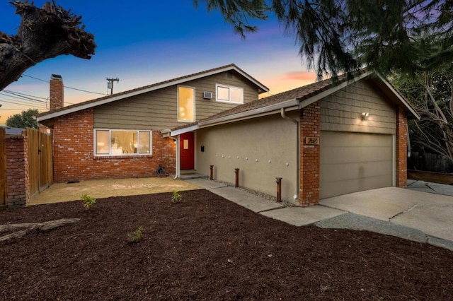 view of front of property with a garage