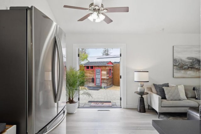 interior space with ceiling fan and light hardwood / wood-style floors