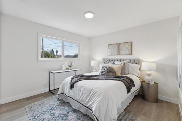 bedroom with light wood-type flooring