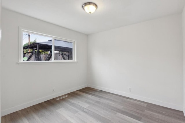 unfurnished room featuring light hardwood / wood-style flooring