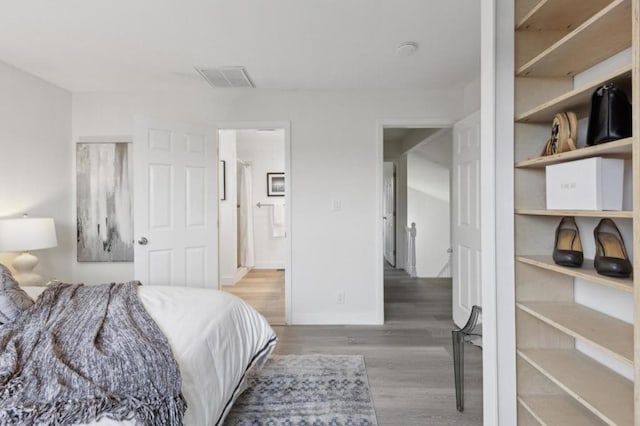 bedroom with hardwood / wood-style flooring