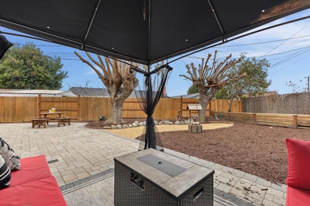 view of patio with an outdoor fire pit