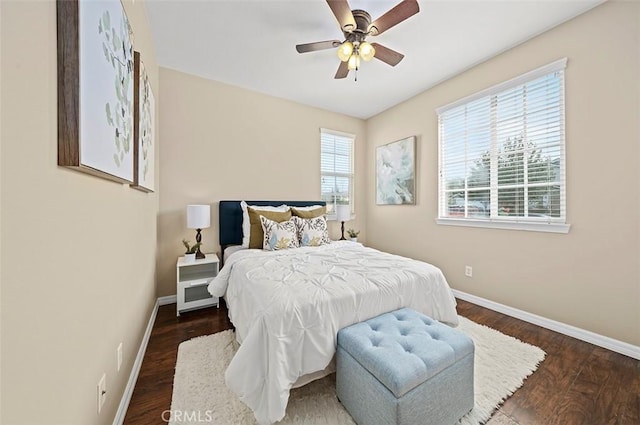 bedroom featuring dark wood-type flooring and ceiling fan