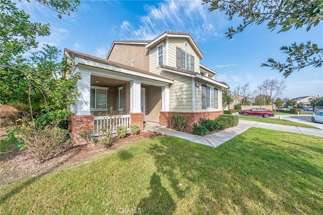 view of front of property with a front lawn and covered porch