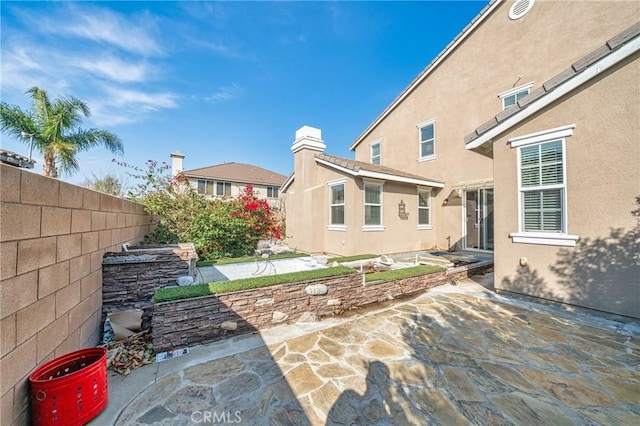 back of house featuring a patio area