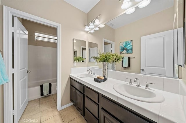 bathroom with vanity, bathing tub / shower combination, and tile patterned floors