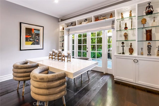 dining room featuring crown molding, dark wood-type flooring, and french doors