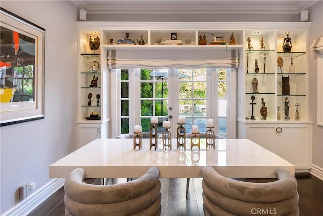 dining room featuring ornamental molding, a healthy amount of sunlight, and french doors