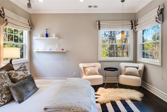 bedroom with crown molding, wood-type flooring, and multiple windows