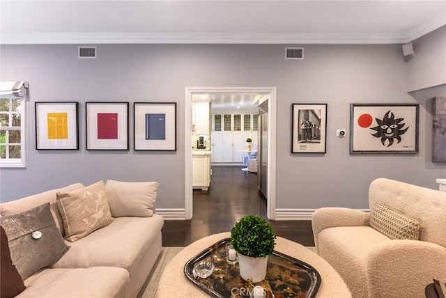 living room featuring crown molding and dark hardwood / wood-style floors