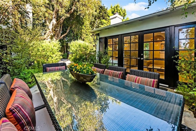 view of patio featuring outdoor lounge area and french doors