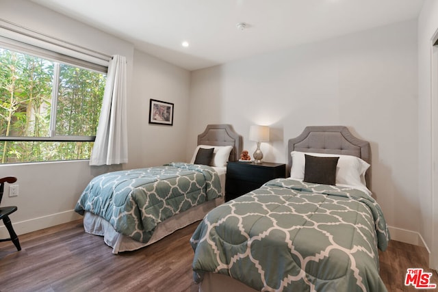 bedroom with wood-type flooring