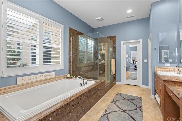 bathroom featuring visible vents, a shower stall, tile patterned floors, a bath, and vanity