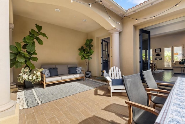 view of patio featuring outdoor lounge area and french doors