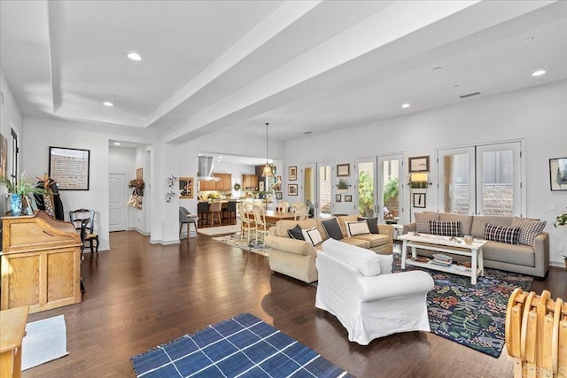 living room featuring visible vents, wood finished floors, recessed lighting, french doors, and a raised ceiling