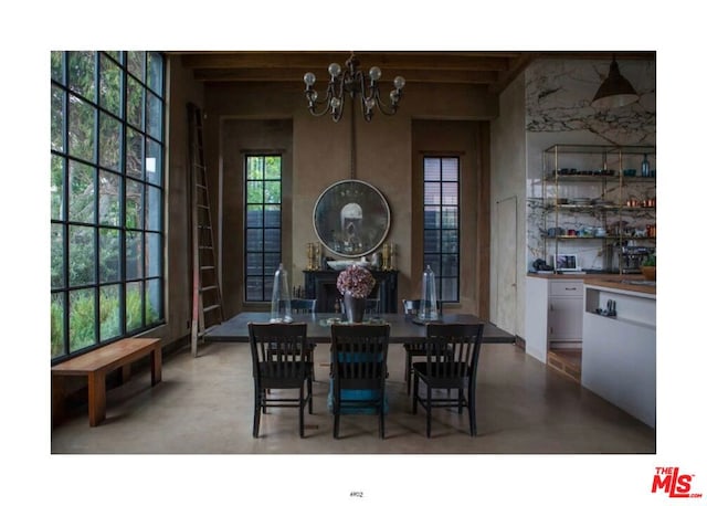 dining room with a notable chandelier