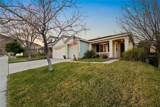 ranch-style house with a garage, a yard, and covered porch