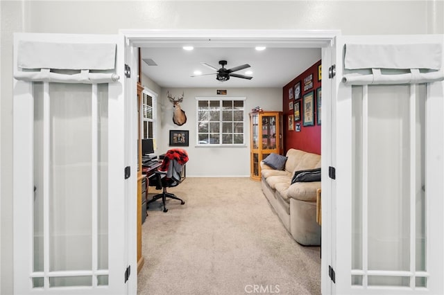 carpeted office with ceiling fan