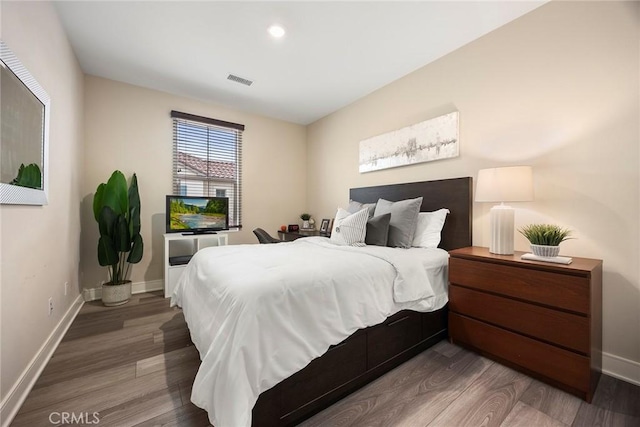 bedroom with wood-type flooring