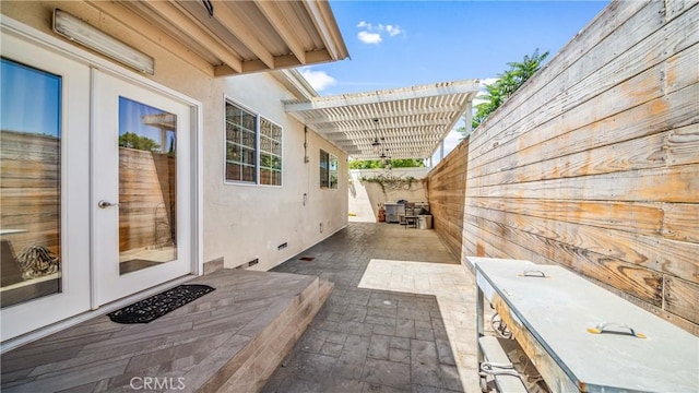 view of patio with a pergola and french doors