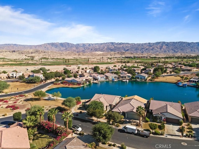 bird's eye view featuring a water and mountain view