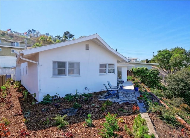 back of house featuring a patio area