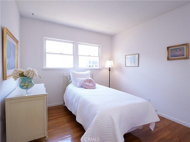 bedroom with wood-type flooring