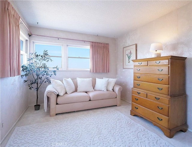 living room with light colored carpet and a textured ceiling