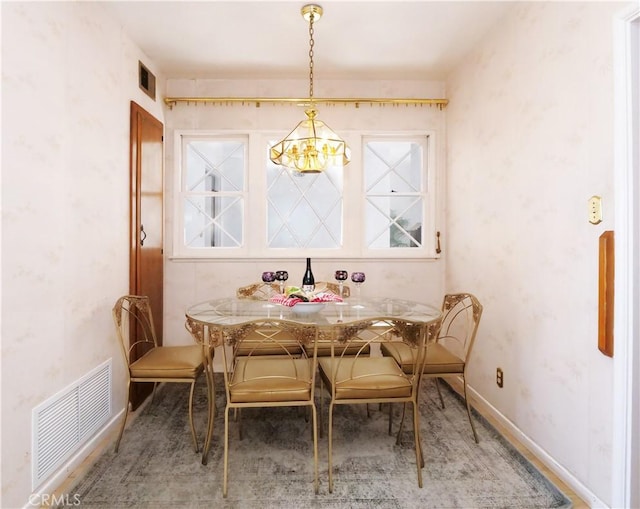 dining room featuring a chandelier