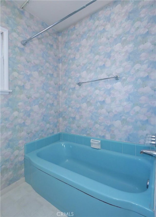 bathroom featuring a bathtub and tile patterned floors