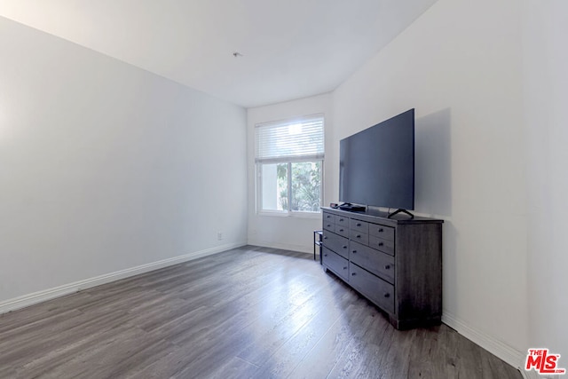 bedroom with hardwood / wood-style flooring