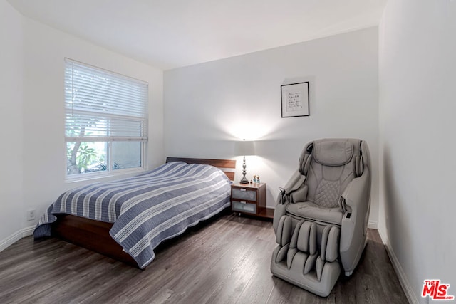 bedroom featuring dark hardwood / wood-style flooring