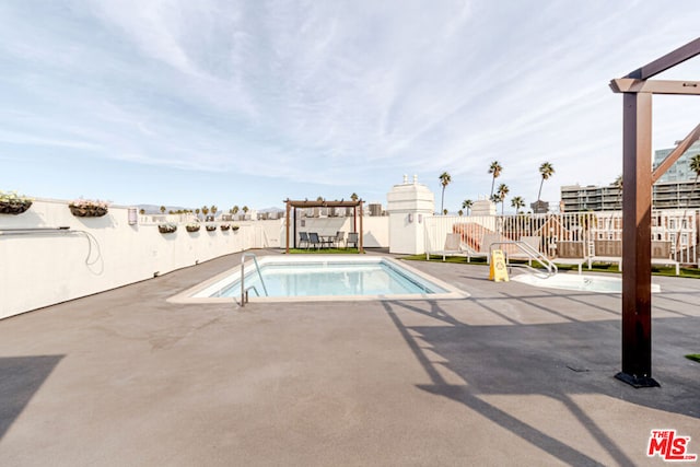 view of pool featuring a pergola and a patio