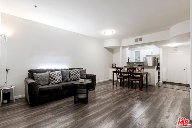 living room featuring dark hardwood / wood-style flooring