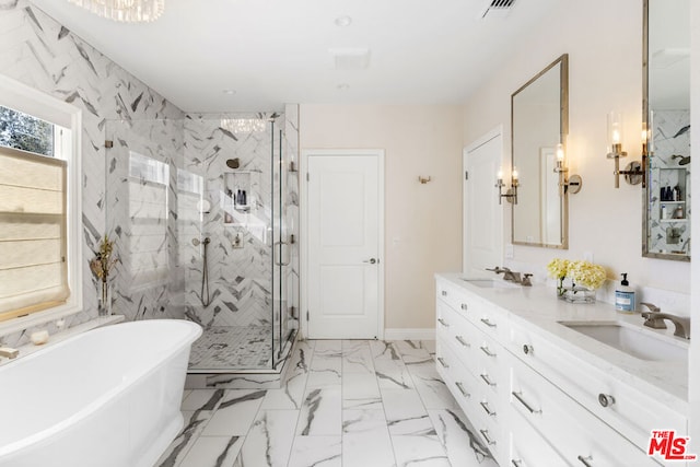 bathroom with vanity and separate shower and tub