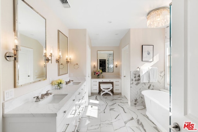 bathroom featuring a tub to relax in, vanity, and tile walls