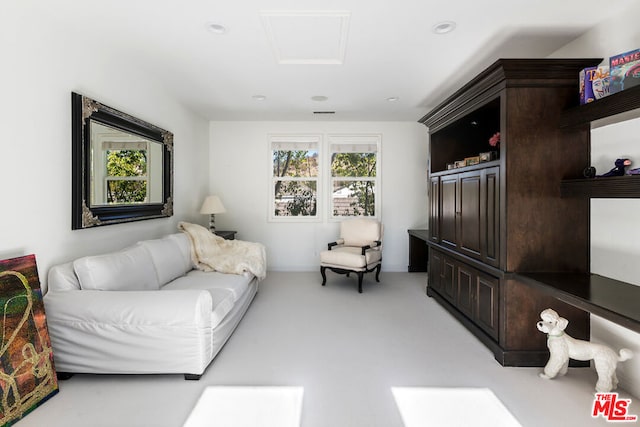 living room featuring light colored carpet and a wealth of natural light