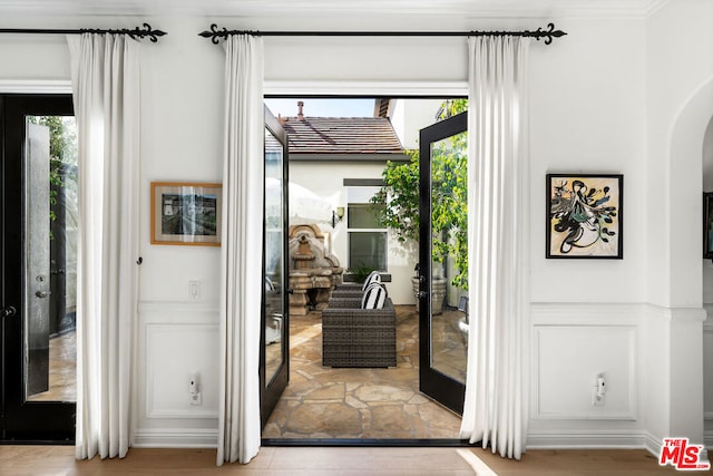 entryway featuring french doors and a healthy amount of sunlight