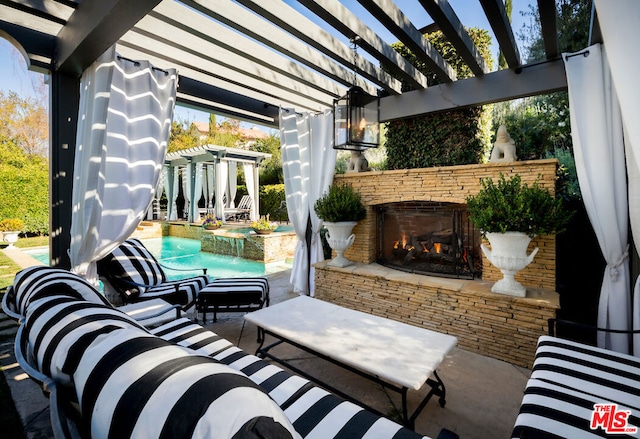 view of patio featuring a pergola, a pool with hot tub, and an outdoor stone fireplace