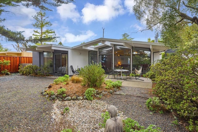 back of property featuring a patio area