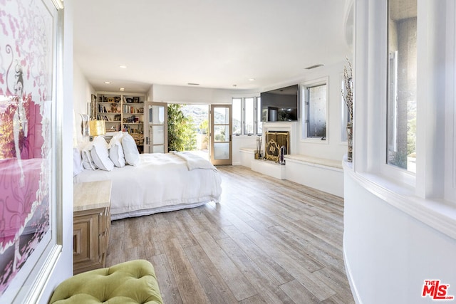 bedroom with light hardwood / wood-style flooring