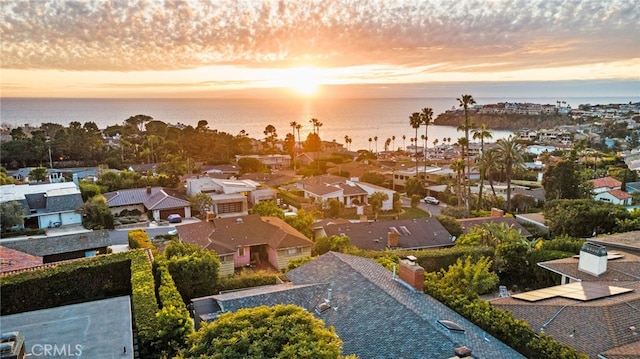 aerial view at dusk with a water view