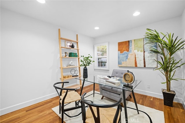 home office with wood-type flooring