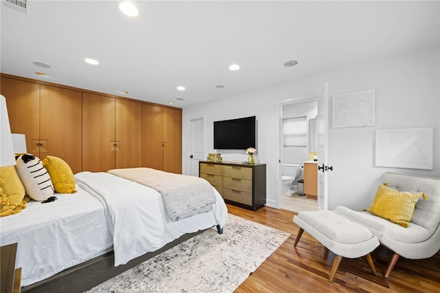 331 Ledroit St, Laguna Beach, CA 92651 - bedroom with visible vents, light wood-style flooring, recessed lighting, and ensuite bath