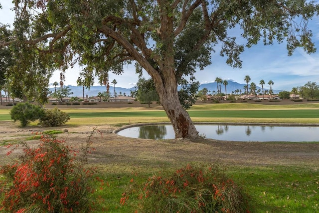 surrounding community with a water and mountain view