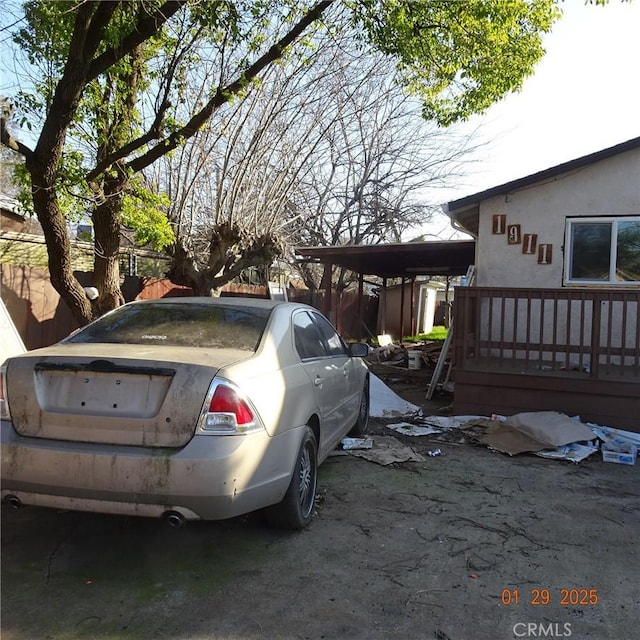 exterior space featuring a carport