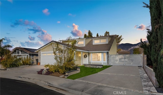 view of property featuring a mountain view and a garage