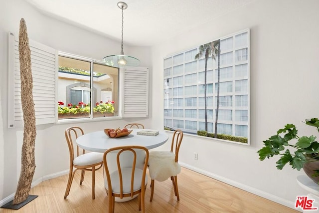 dining area with light hardwood / wood-style flooring